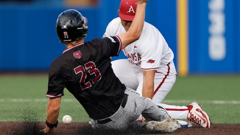 Missouri State's Taeg Gollert (23) steals second base as Arkansas shortstop Camden Kozeal,...