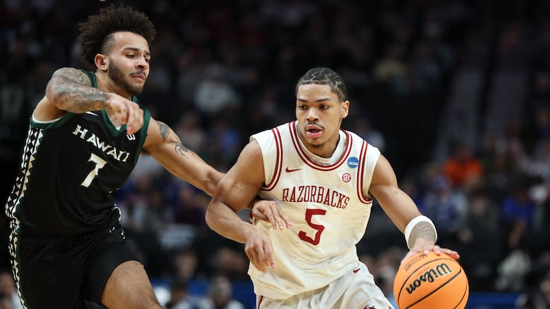 Arkansas guard Darius Acuff Jr. (5) drives the ball past Hawaii guard Isaiah Kerr (7) during...