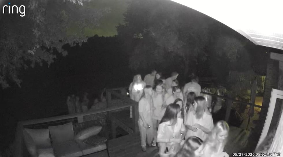 Doorbell camera video shows around 56 high school seniors sneaking into their principal's...