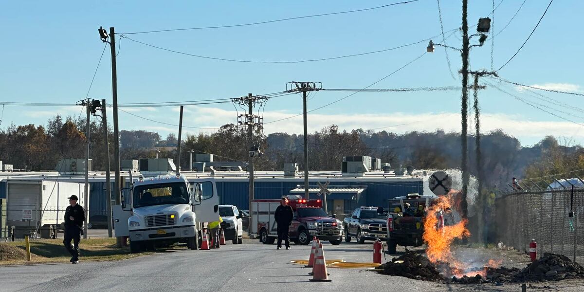Leaking Fire Fire crews work to control gas leak and fire