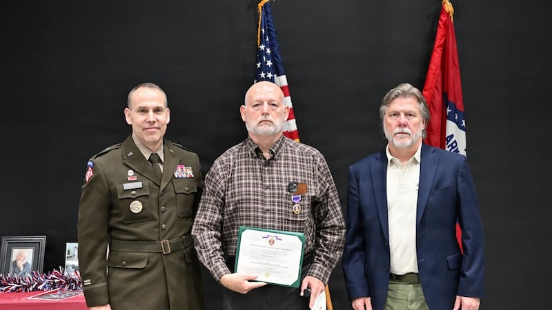 A retired Arkansas National Guard NCO received the Purple Heart nearly 20 years after...