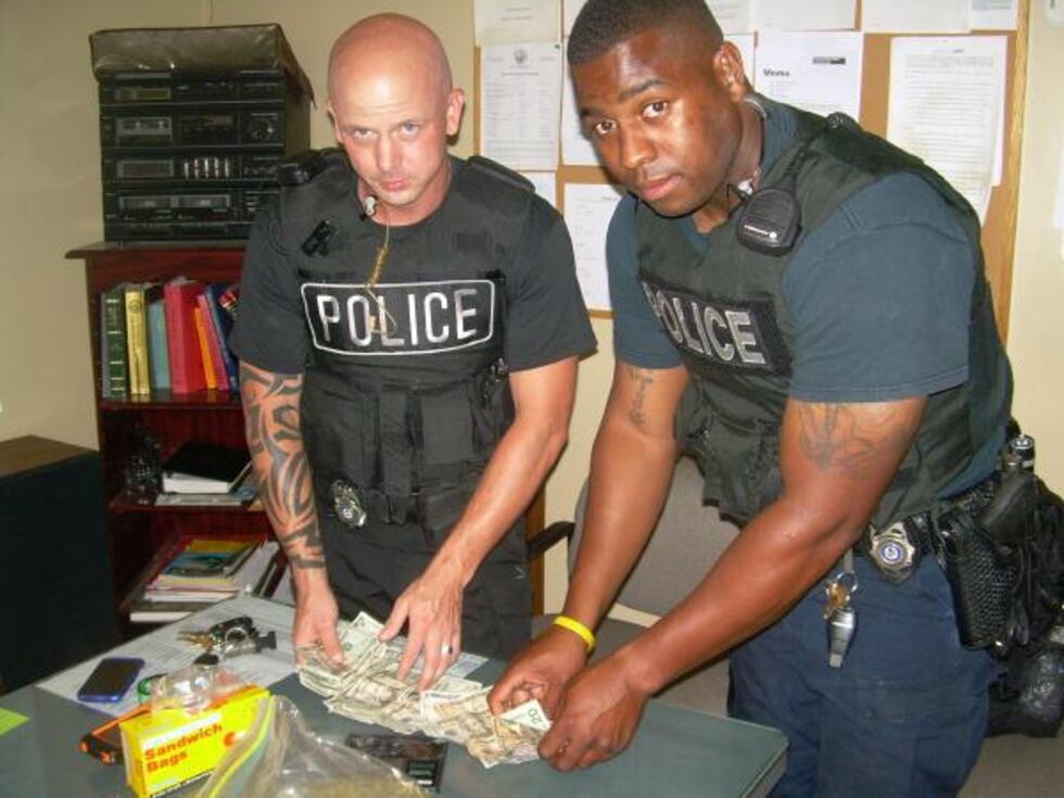 Street Crime unit officers with seized items (Source: Forrest City Police Department)