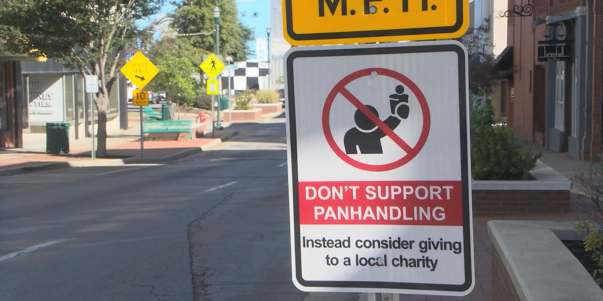 Panhandler Street Sign City installs signs to deter giving to panhandlers
